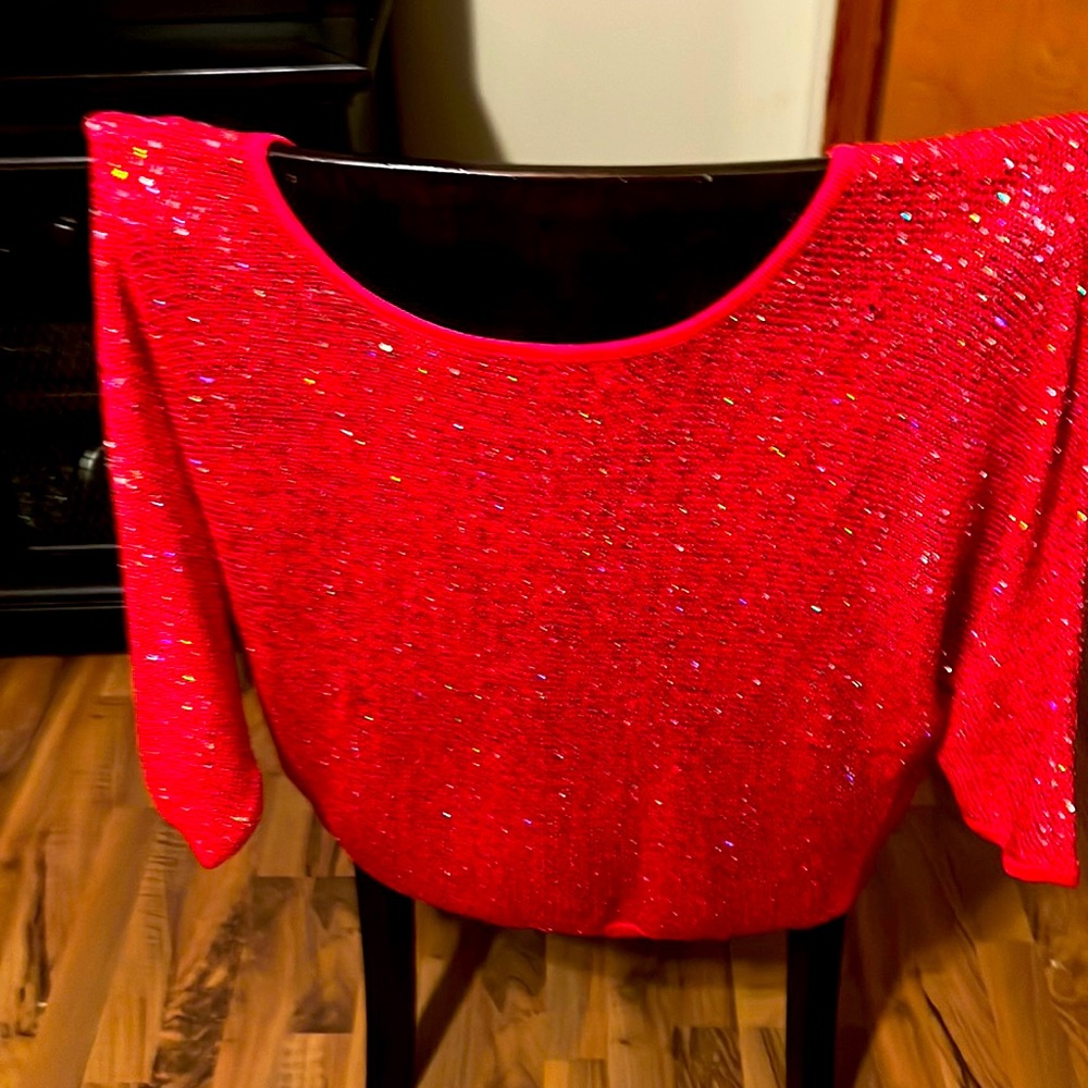 Bright red sparkly top.